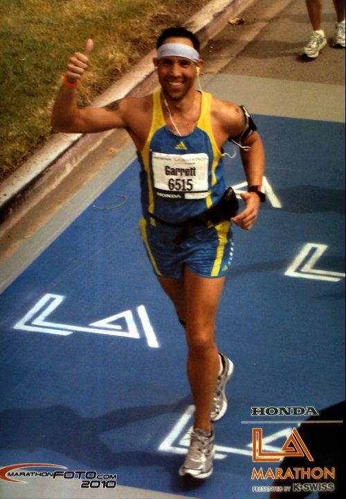 Garrett McClure finishing the LA Marathon in 2010, giving a thumbs up