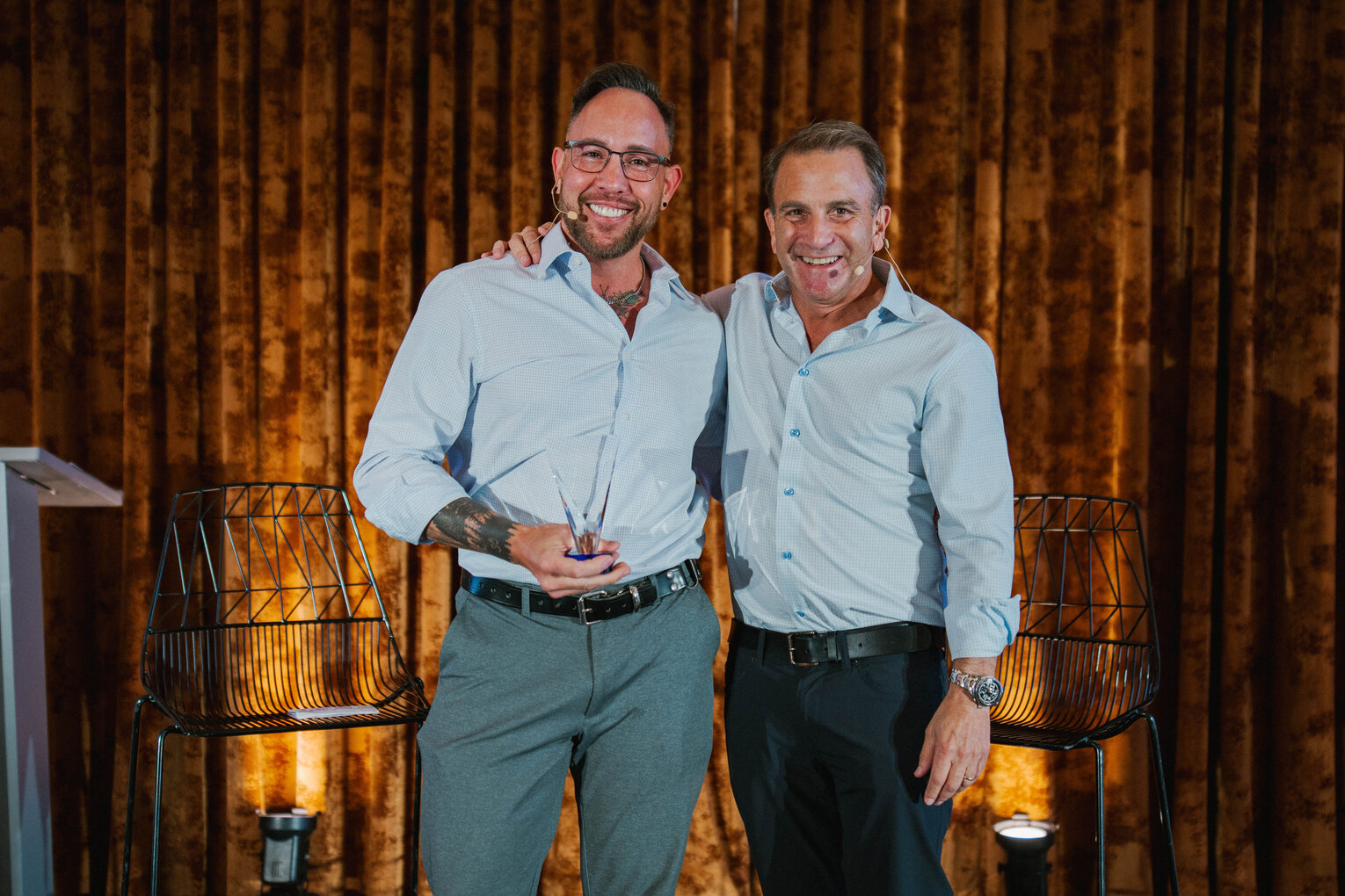 Garrett McClure with his mentor Tom Shipley on the DealCon stage