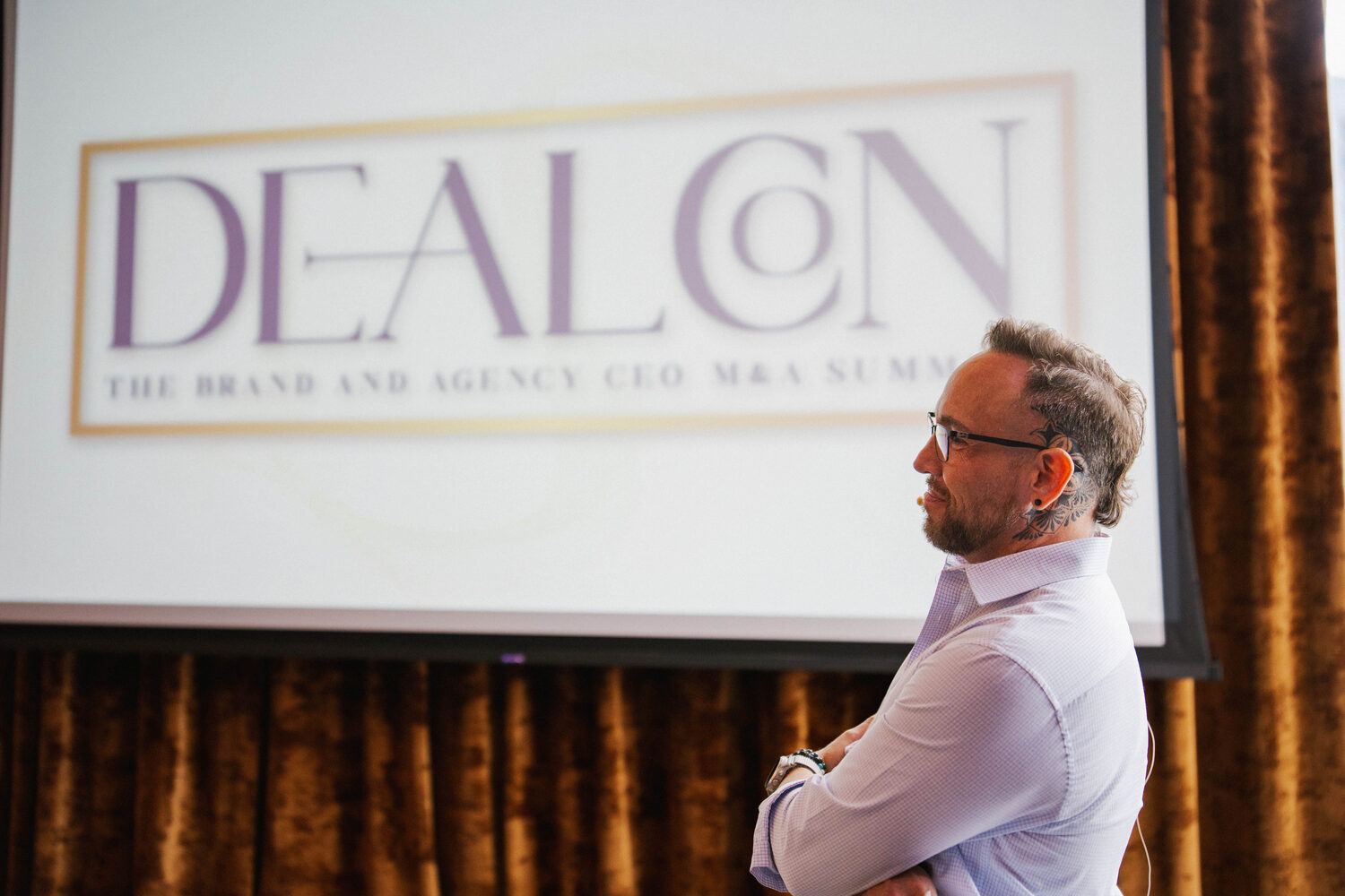 Garrett McClure on stage at DealCon, the Brand and Agency CEO M&A Summit