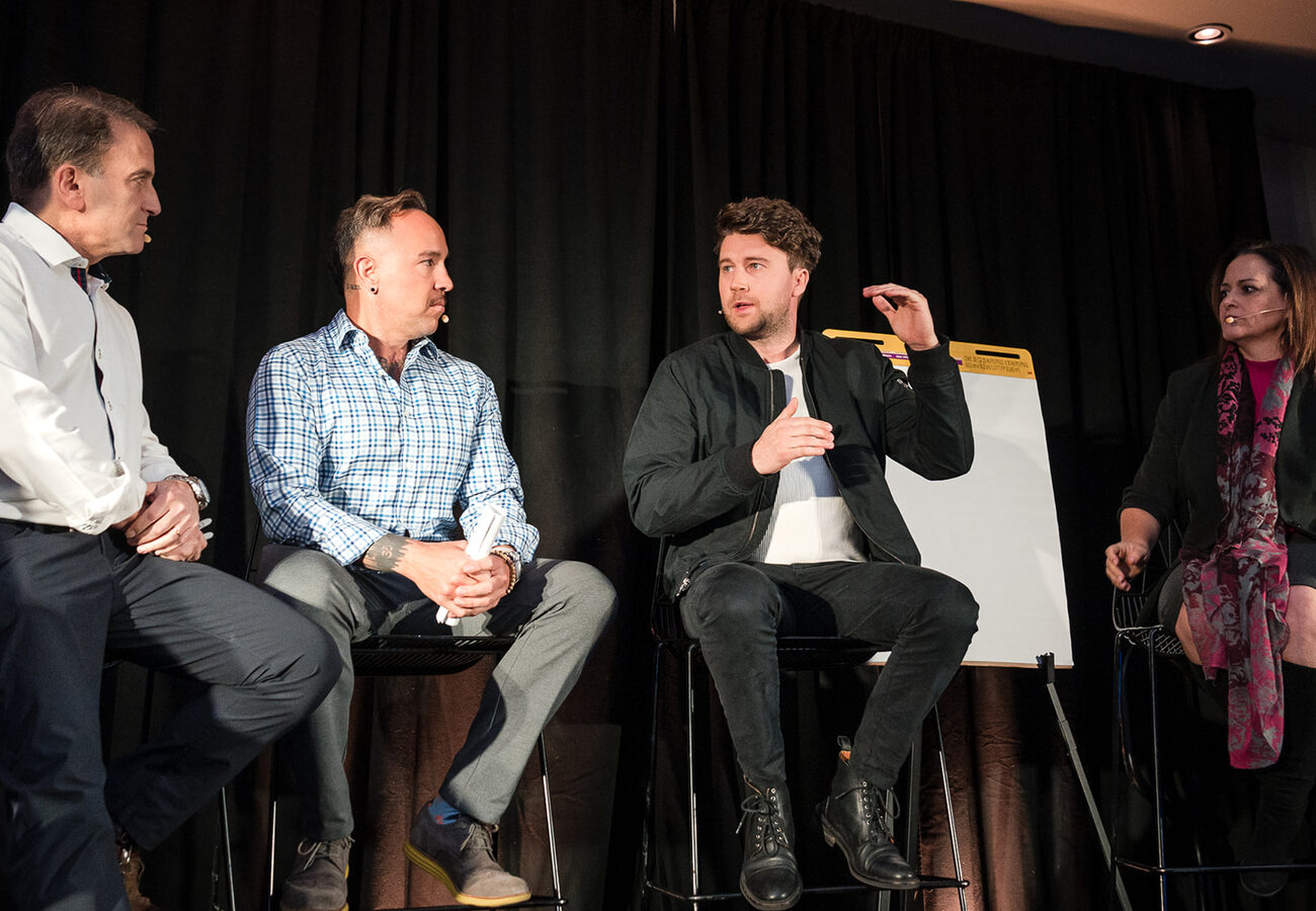 Garrett McClure on a panel at DealCon