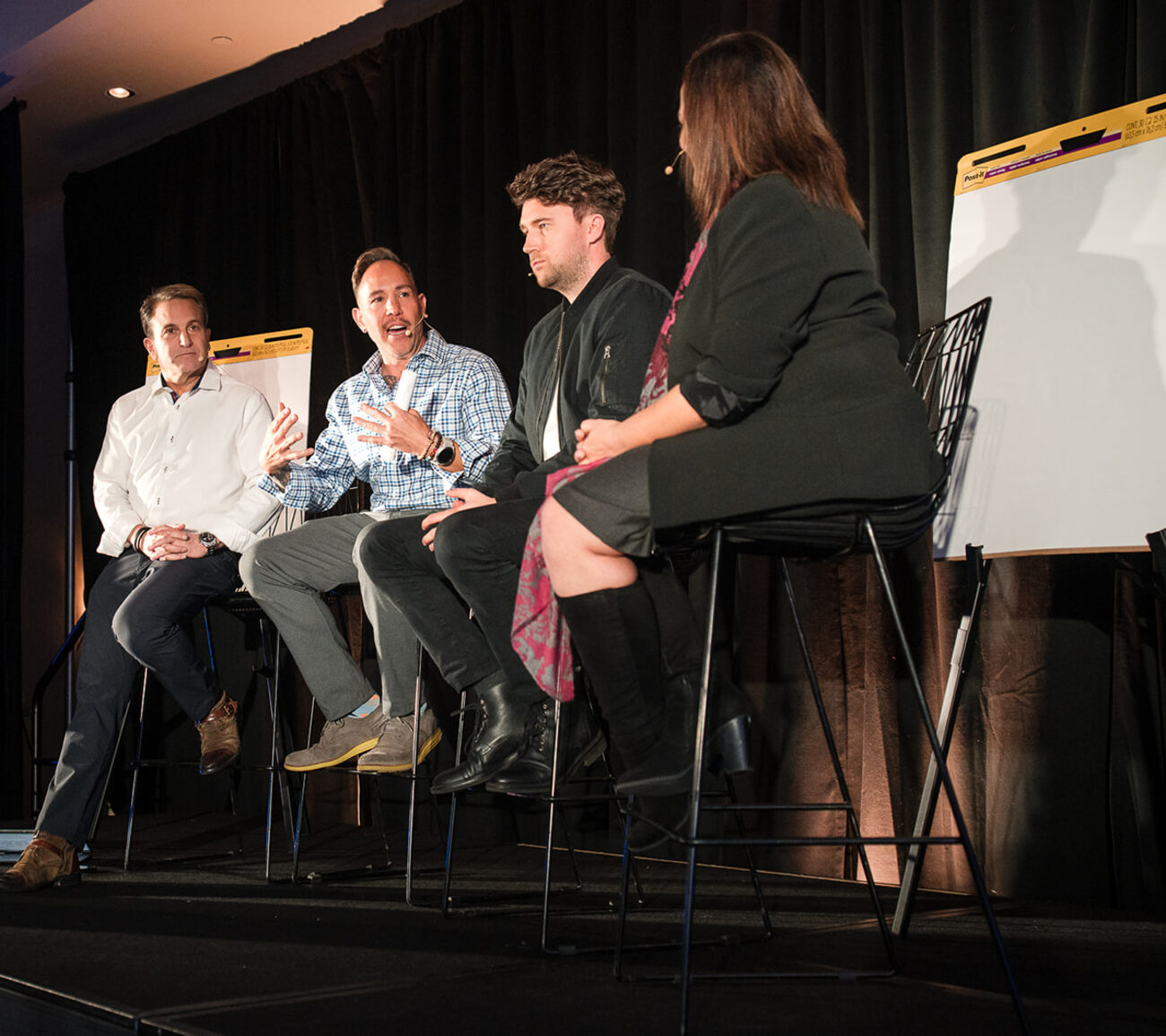 Garrett McClure on a live deal panel on stage at DealCon